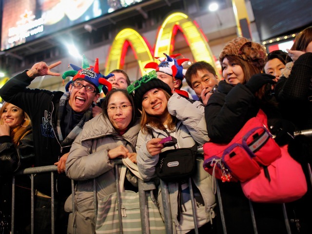 Revelers gather together as thousands gather in New York's Times Square to celebrate the ball drop at the annual New Years Eve celebration on December 31, 2011 in New York City. 