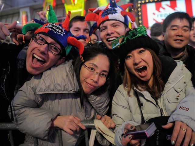 Revelers gather together as thousands gather in New York's Times Square to celebrate the ball drop at the annual New Years Eve celebration on December 31, 2011 in New York City. 