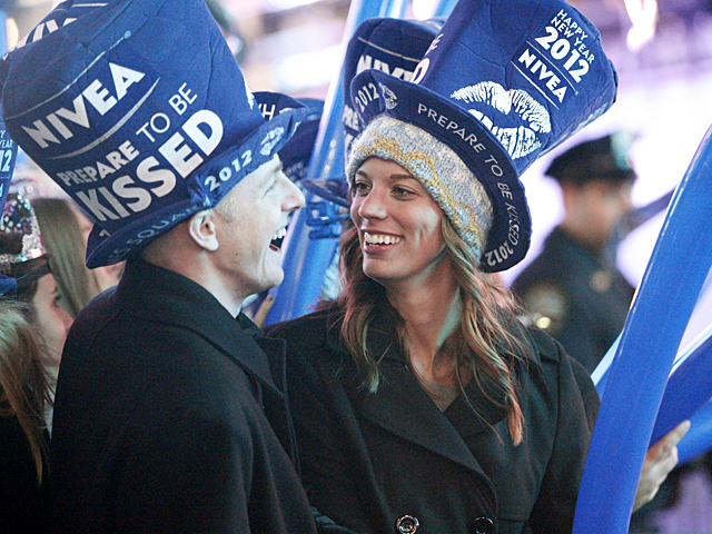 A couple enjoy a romantic moment in Times Square on New Year's Eve, 2011.