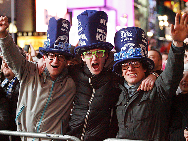 A group of guys celebrate the New Year in Times Square, 2011.