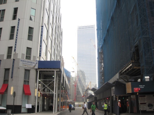The crane stands between the hotel, left, and the Deutsche Bank building, right.

