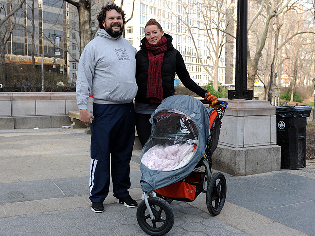 Scott Biel, 33, wears Uniqlo Heattech clothing under his sweatshirt and track pants and Gabrielle Derrig, 30, keeps her five-month-old child warm with two blankets while running through Central Park on Jan. 6, 2012. 