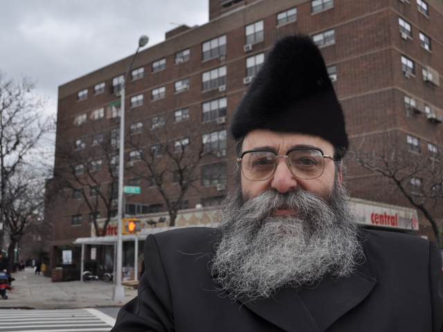 Rabbi David Niederman stood in front of Kent Housing to express outrage at a recently found swastika in the elevator.