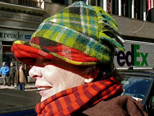 Dympna B. in a mixed tartan hat  and cashmere stripes on Broadway.
