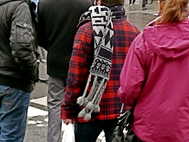 Bold red and black hunter jacket with tribal style knit scarf on Union Square.