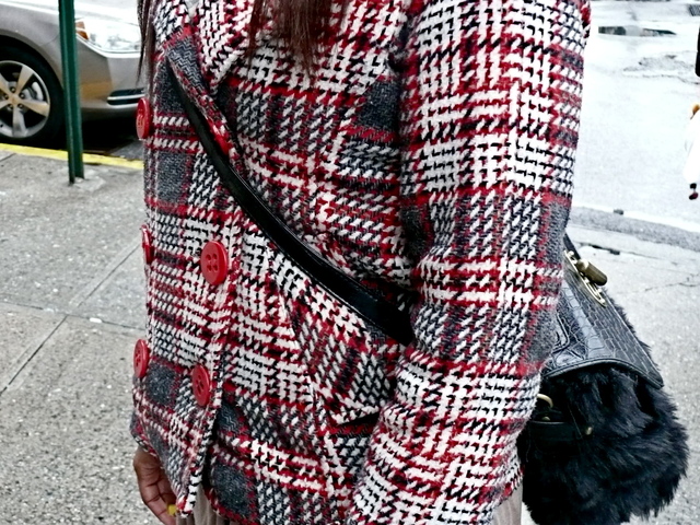 Detail of Deona G's bold choice accessory worn with checks in the West Village.