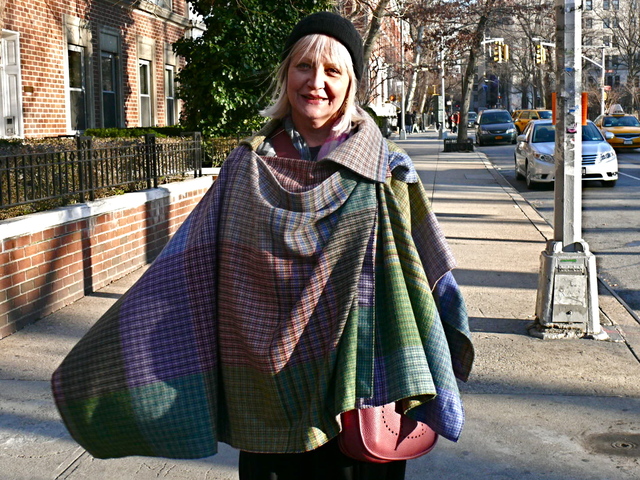 Diane F. in a colorful, layered draped cape by Vivienne Westwood in Washington Square Park.