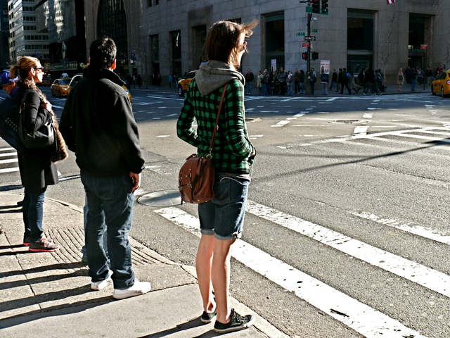 Brave and bold graphic green and black checks with knit hoodie on Fifth Avenue and 57th Street.