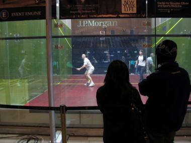 On Thursday, Jan. 26, 2012, several people lingered in front of the glass cube, watching the squash players practice.