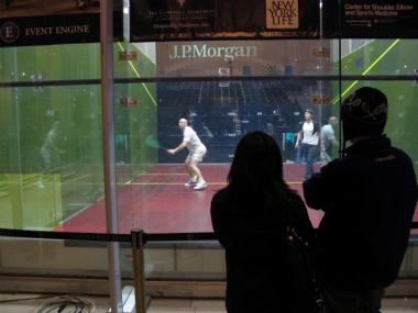 On Thursday, Jan. 26, 2012, several people lingered in front of the glass cube, watching the squash players practice. 