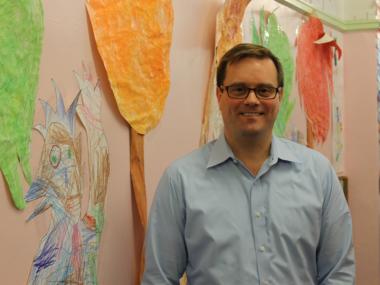 Bob Bender, principal of P.S. 11, in the hallway of the school.