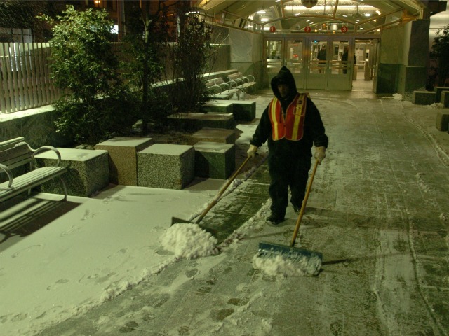 <p>An MTA worker shovels snow outside the 96th Street 1-2-3 station.</p>
