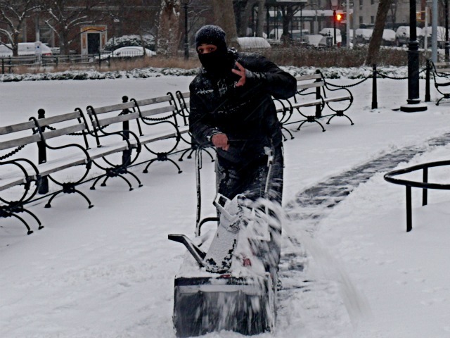<p>A man pushes a snow-blower in Washington Square Park on Sat., Jan. 21, 2012.</p>
