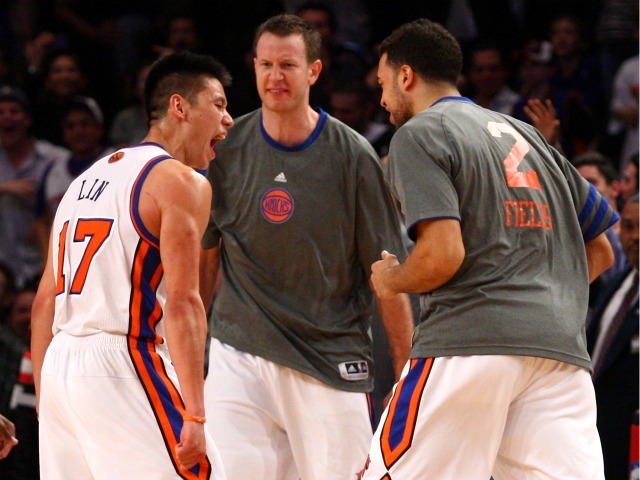 Jeremy Lin celebrates with Knicks teammates Steve Novak and Landry Fields after draining a three-pointer against the Lakers.