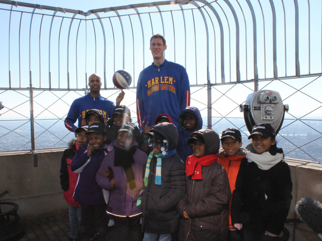 'Flight Time' Lang and 'Tiny' Sturgess pose with kids from Garden of Dreams on top of the Empire State Building.