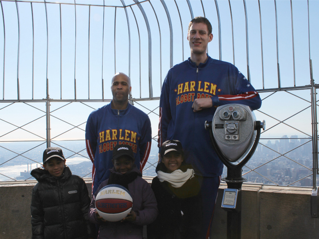 'Flight Time' Lang and 'Tiny' Sturgess pose with kids from Garden of Dreams on top of the Empire State Building.