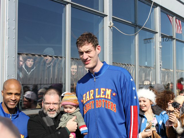 Sturgess poses with a baby on top of the Empire State Building.