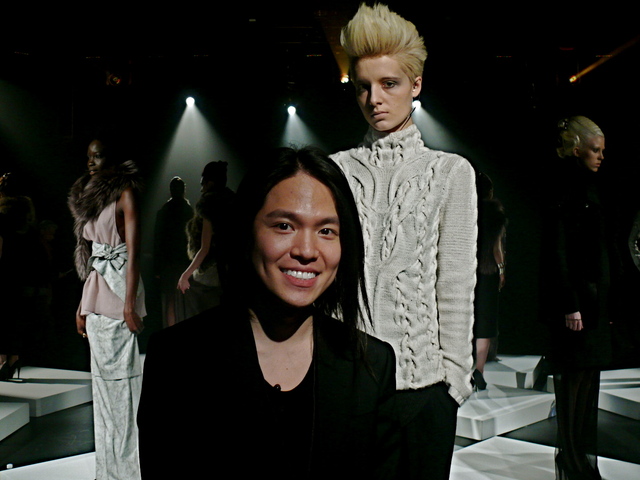 Designer Brandon Sun with his ivory cashmere evolution sweater on Alina.