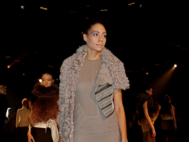 Amanda in cashmere gauze maxi-dress, a storm grey shearling stole with reptilian lace trim.