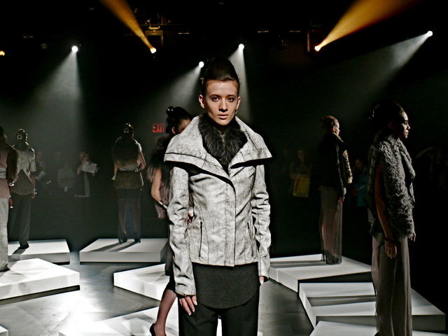 Kaytya is a blizzard cracked biker style leather jacket, gray cashmere tunic tank and crepe gabardine pants.