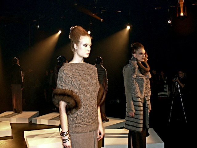 Katerina in anthracite serpentine hand-kitted cashmere pullover with sable cuffs, part of the monochromatic trend.