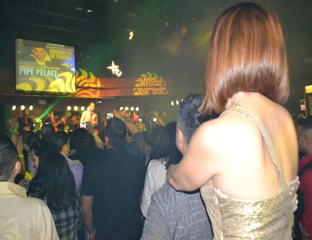 Latino couples watch bachata singer Frank Reyes at La Boom nightclub in Woodside, Queens.