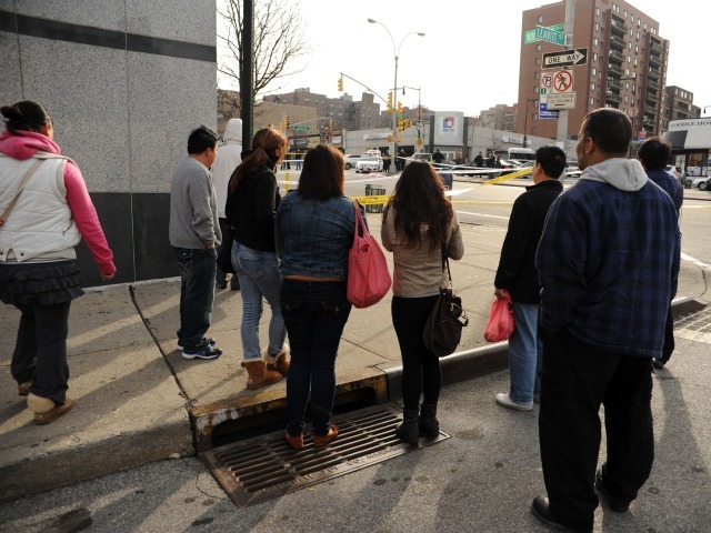 Onlookers gawked at Northern Blvd. and Union Street, where a woman was struck and killed on Feb. 22, 2012.
