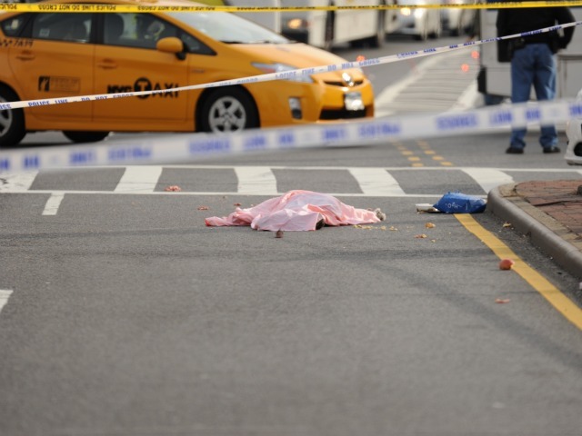 The body of woman who was struck and killed by a city bus lay at the intersection of Northern Blvd. and Union Street.