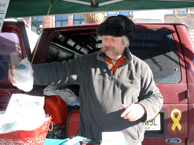 Braxton wraps up three emu eggs for a returning customer.