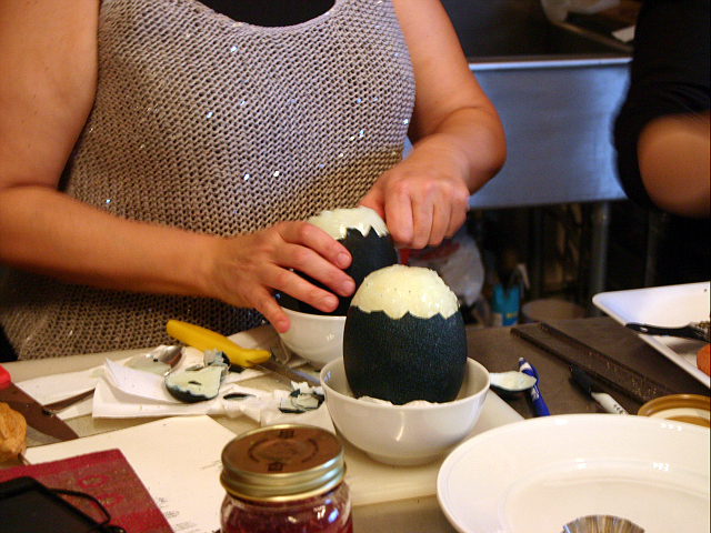 The eggs were scooped out of their shells using large spoons.