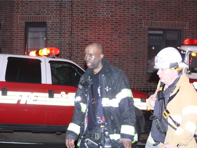 <p>An EMT leads a firefighter to an ambulance. A small group of New York City EMTs and paramedics, led by former FDNY EMT Walter Adler, are working to create the first citywide advocacy organization for emergency medical workers.</p>
