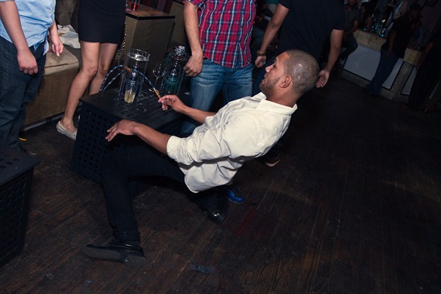 A reveler dances near a hookah at Negro Claro.