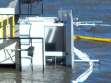 Two People Rescued After Crane-Carrying Boat Overturns at Liberty Island