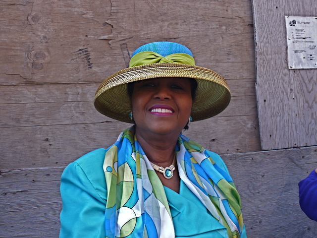 Aurelia C-T. in aqua hues and a gold medium brim with a scarf detail.