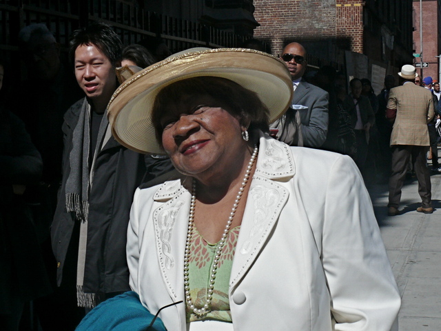 Delores J. wearing simple and chic golden halo style hat.