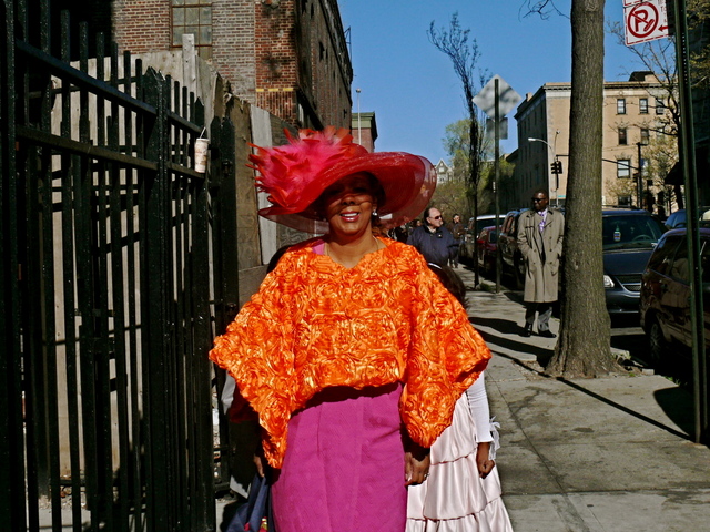 Sussan M. in a Kentucky Derby style wide brim in vibrant flame shades.