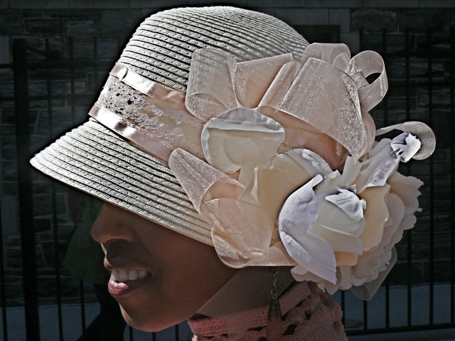 Lashekia C. cloche style confection of ribbon, lace and roses.