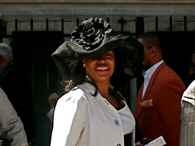 Nadja W. in an unstructured sheer black hat with ruche rose detail.