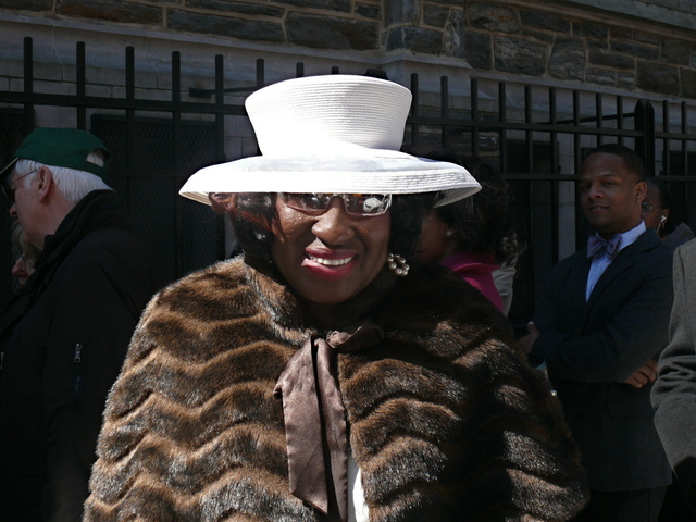 Patricia A. in a simple white hat with a wide crown.