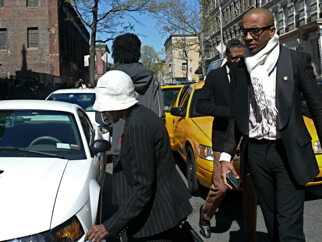 Actress Cicely Tyson arrives in soft straw cloche hat and sharp pinstripe suit.