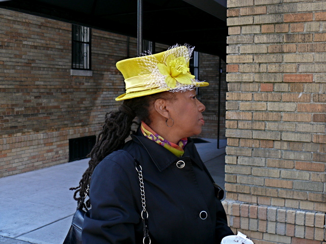 Wanda C. in a sunny yellow small structured silhouette with net and floral details.