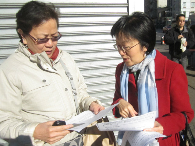 Councilwoman Margaret Chin discusses the recent groping incidents with a woman in Chinatown April 12, 2012. 