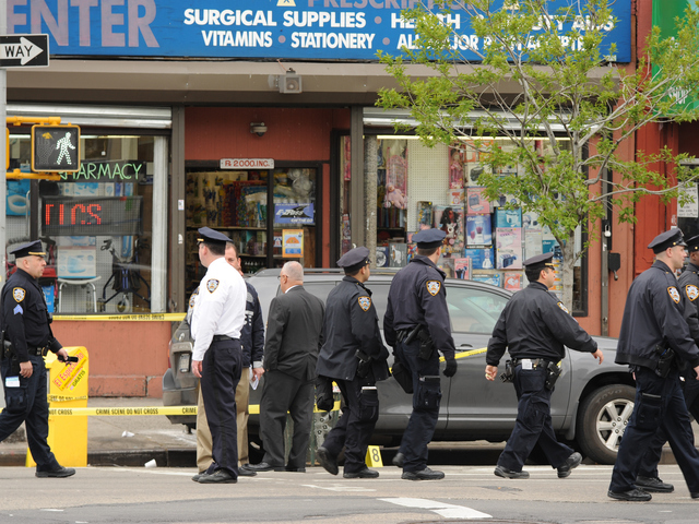 Police — including a retired lieutenant — shot and killed an armed drugstore robber in East Harlem Thursday morning. 