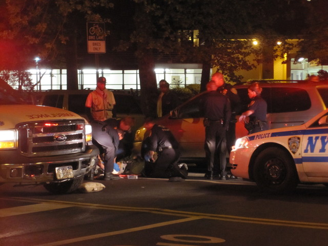 Officials tends to a pedestrian  struck on the Lower East Side after 9 p.m. on April 19, 2012, on East Broadway.