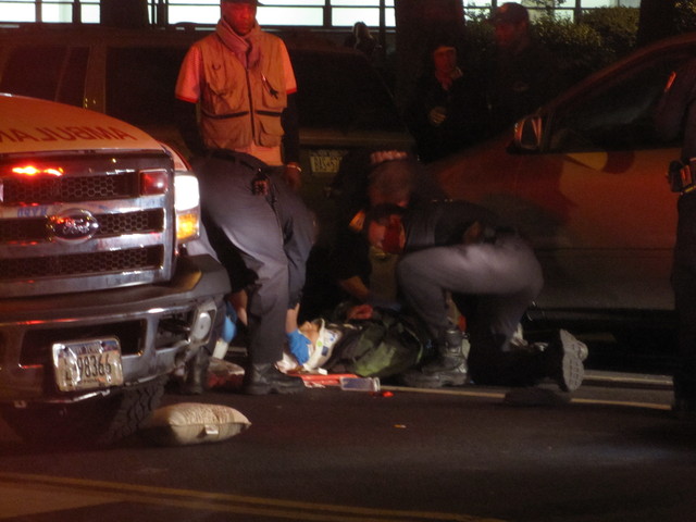 Officials tend to a pedestrian  struck on the Lower East Side after 9 p.m. on April 19, 2012, on East Broadway.