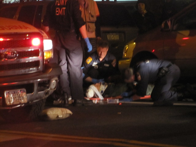 Officials tend to a pedestrian  struck on the Lower East Side after 9 p.m. April 19, 2012, on East Broadway.