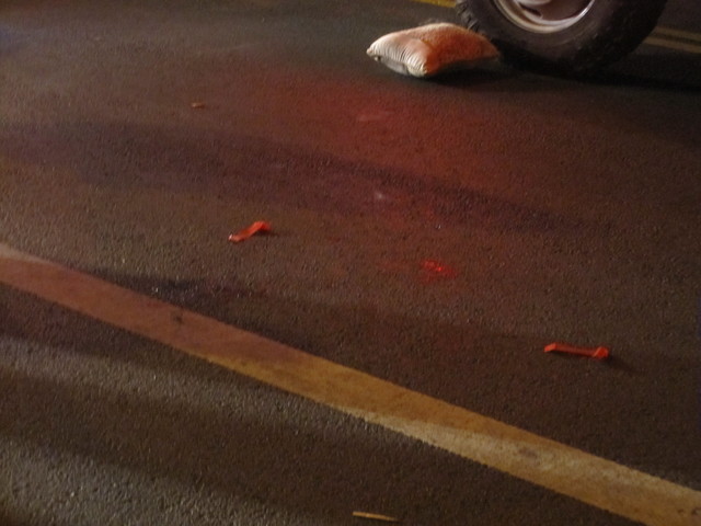 Someone placed a pillow on the ground to make the victim more comfortable, witnesses said.