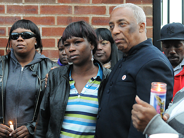 City Councilman Charles Barron stands next to Yakim McDaniels mother, Doris Chase, at a vigil for her son, May 7, 2012. 