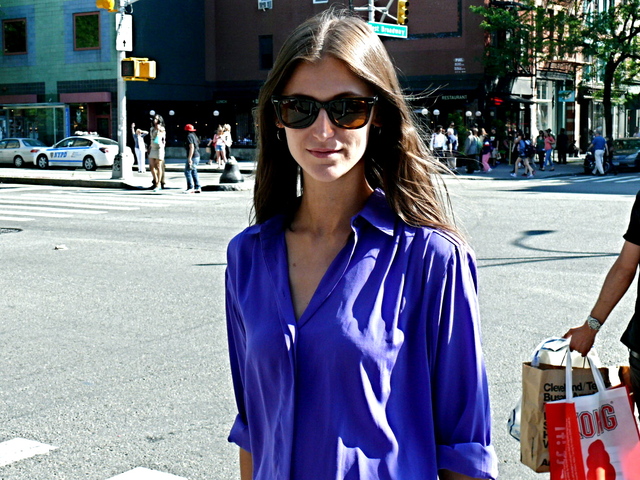 Daiane C. in a vibrant lightweight violet blue blouse on La Guardia Place in the Village