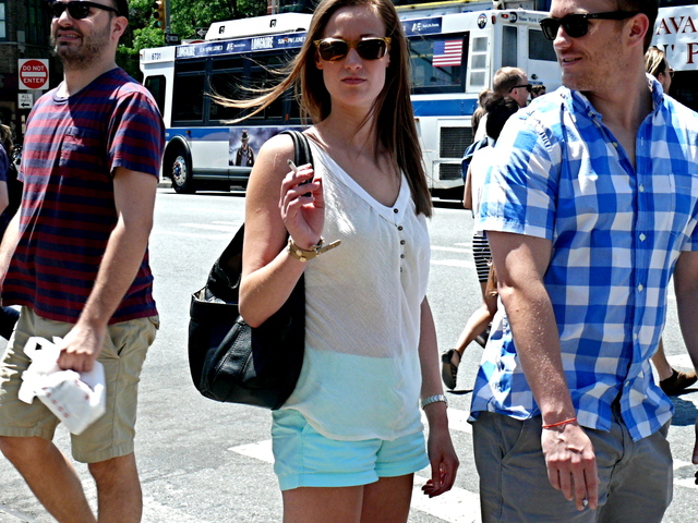 Sheer cotton top perfectly paired with spruce celadon blue leg baring shorts in the West Village
